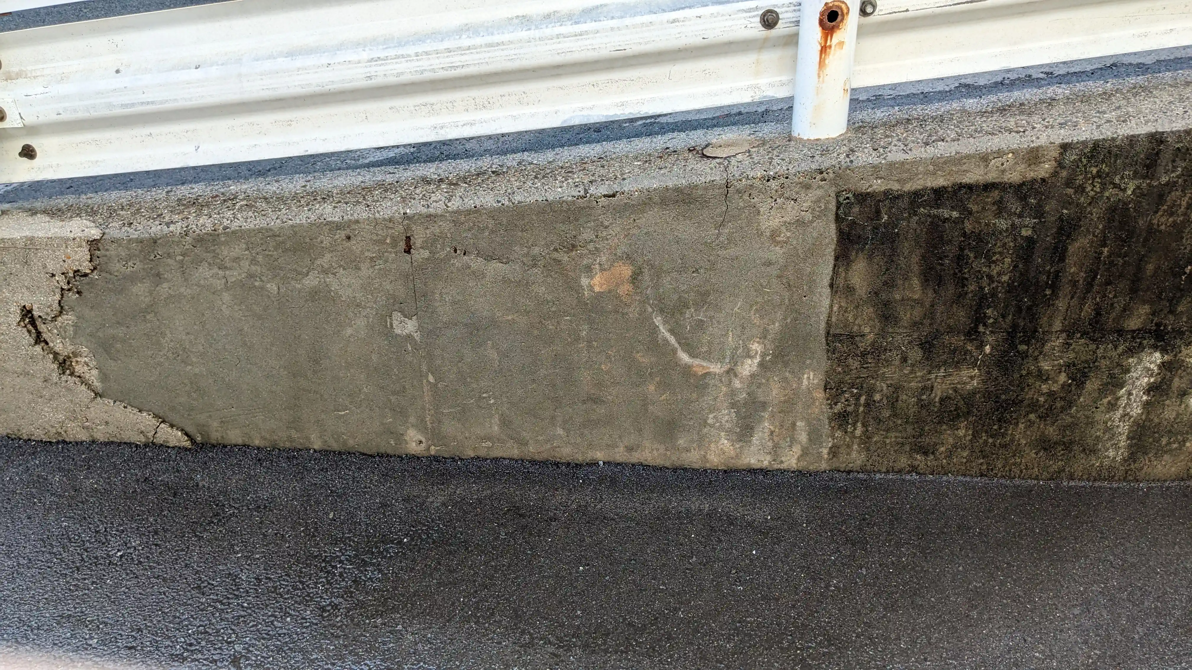 Concrete wall and ramp exterior cleaning in progress